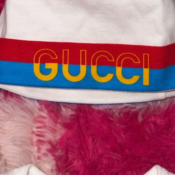 Gucci Kids' White Bib, Onesie And Beanie Set with Blue, Red, and Yellow Accents - Picture 6 of 7